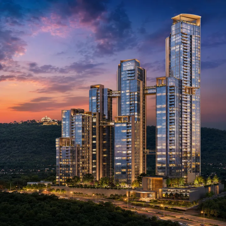 Sattva Hill View 149-metre skyline tower against the Art of Living hill ridge at dusk Sattva Hill View 149-metre skyline tower against the Art of Living hill ridge at dusk